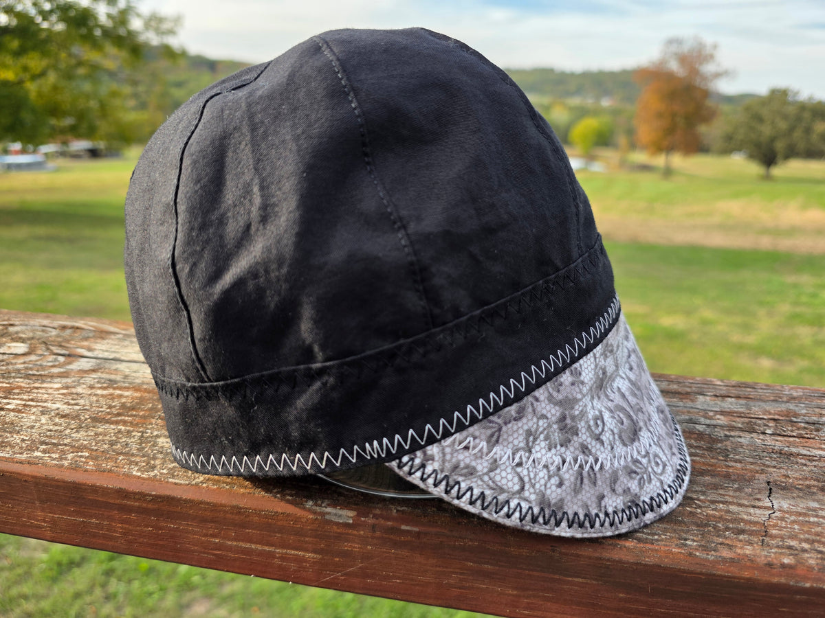 Women's 8-panel welding cap in gray floral lace with black band, reversible side