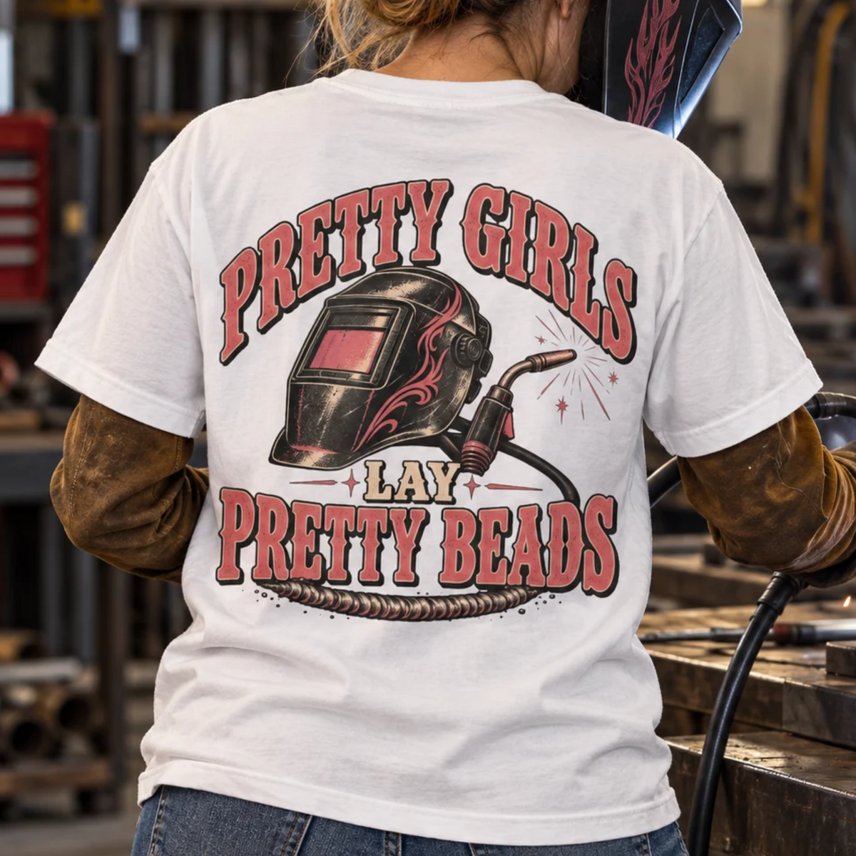 Pretty Girls Lay Pretty Beads women welder shirt with pink flame welding hood and MIG gun back print