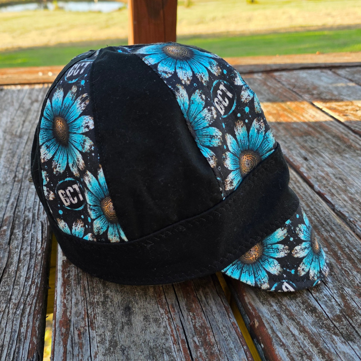 Women's 8-panel welding cap in turquoise daisy print by Blue Collar Trash